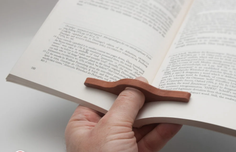 one hand book holder.